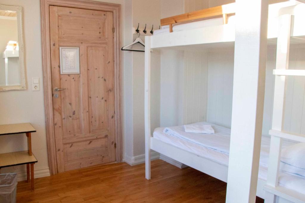 Postel nebo postele na pokoji v ubytování 1908 Hostel by Ourhotels