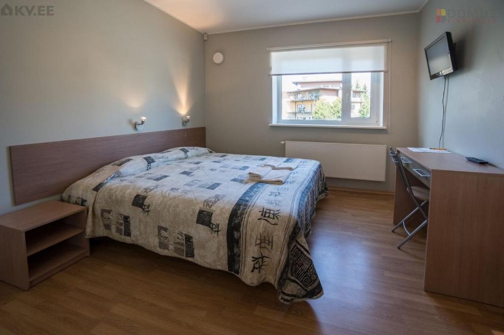 Postel nebo postele na pokoji v ubytování Nuustaku Villa