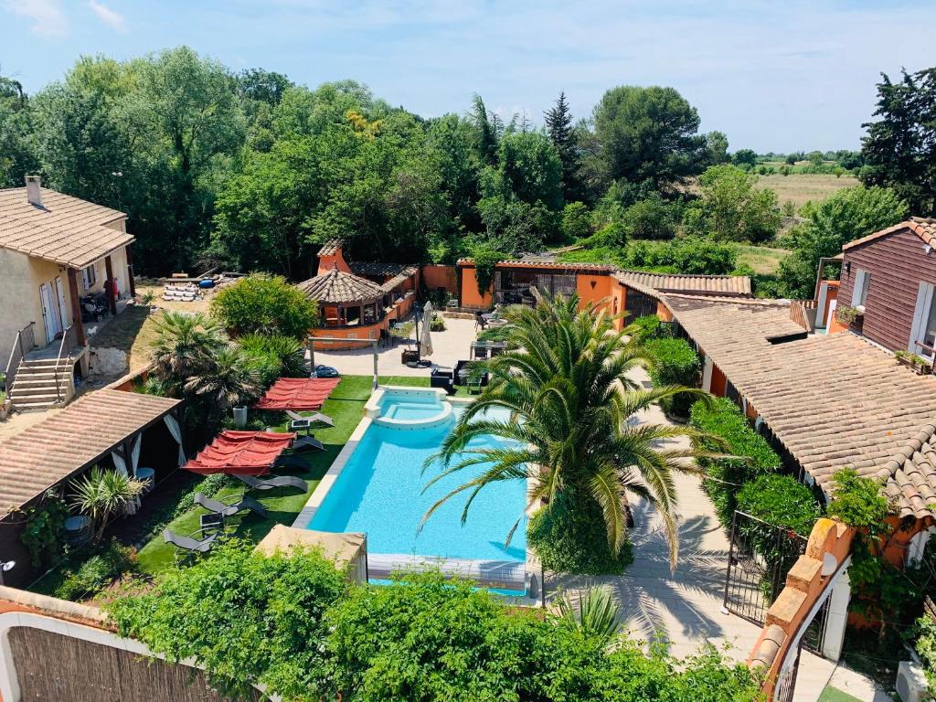 an aerial view of a resort with a swimming pool at B&B Le Patio34 in Lavérune