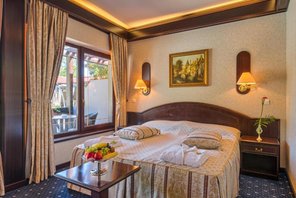 Postel nebo postele na pokoji v ubytování Hotel Snagov Club