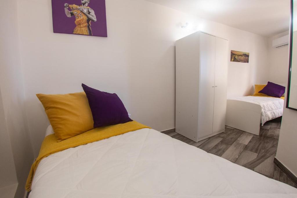 Posteľ alebo postele v izbe v ubytovaní Donna Carmen Casa Vacanze