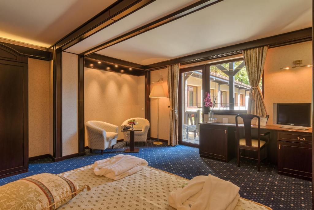 Postel nebo postele na pokoji v ubytování Hotel Snagov Club