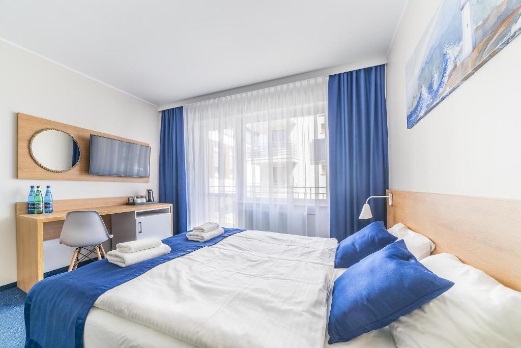 Postel nebo postele na pokoji v ubytování Navii
