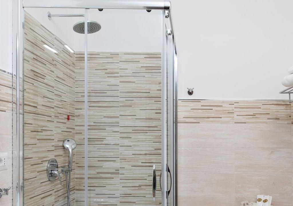 a shower with a glass door in a bathroom at Hotel Residence Nemo in Brindisi