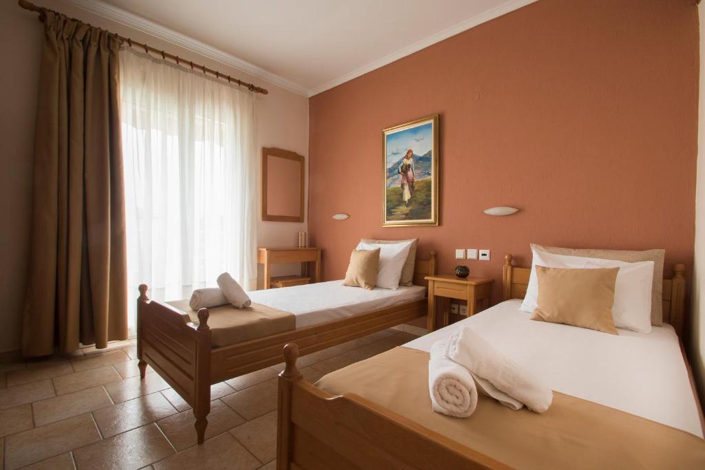 Postel nebo postele na pokoji v ubytování Atira Apartment Hotel