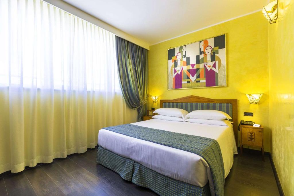Postel nebo postele na pokoji v ubytování Best Western Hotel Artdeco
