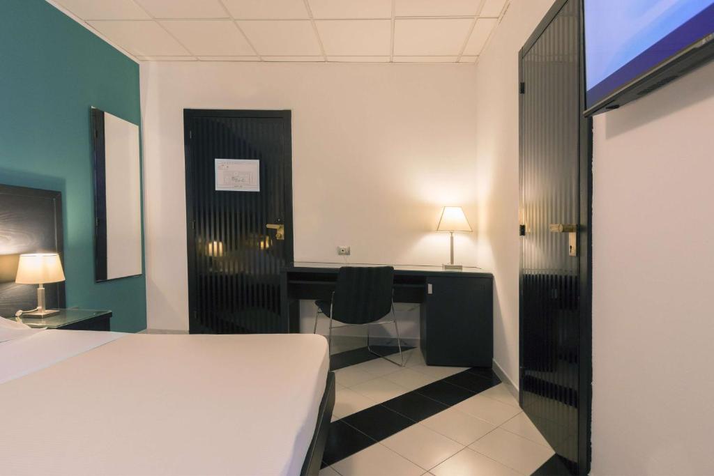Postel nebo postele na pokoji v ubytování Executive Business Hotel