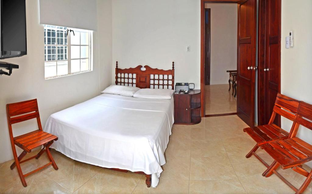 Cama o camas de una habitación en Hotel Savoy