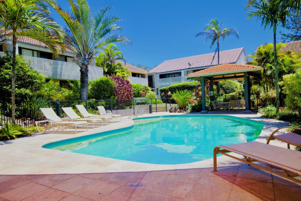 a patio with a pool and a pool table at Peregian Court Resort in Peregian Beach