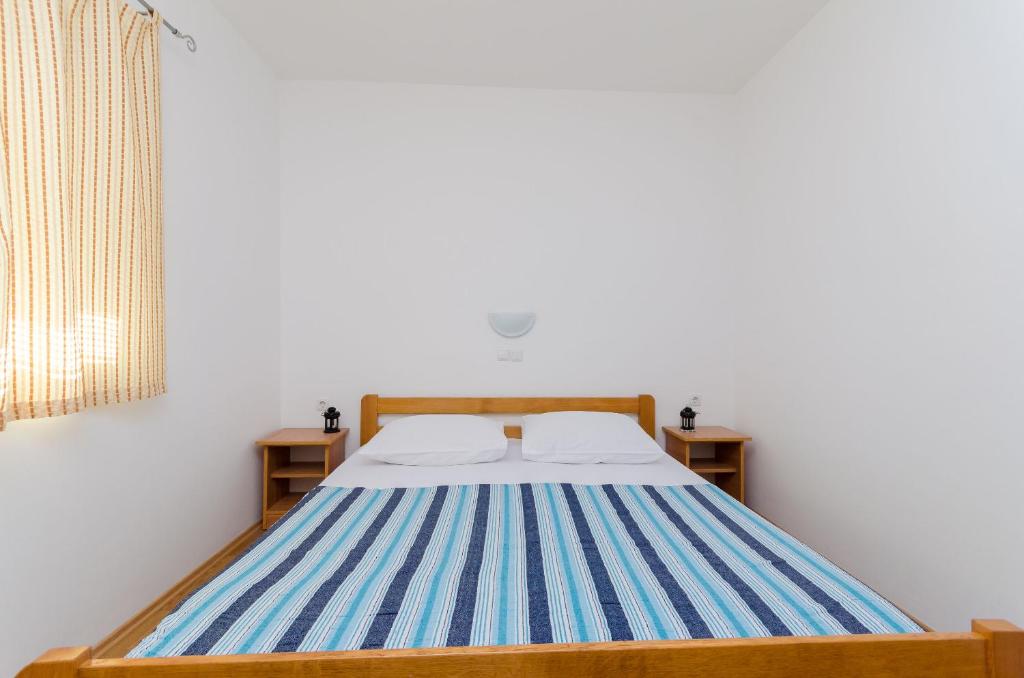 Posteľ alebo postele v izbe v ubytovaní Apartments Alex