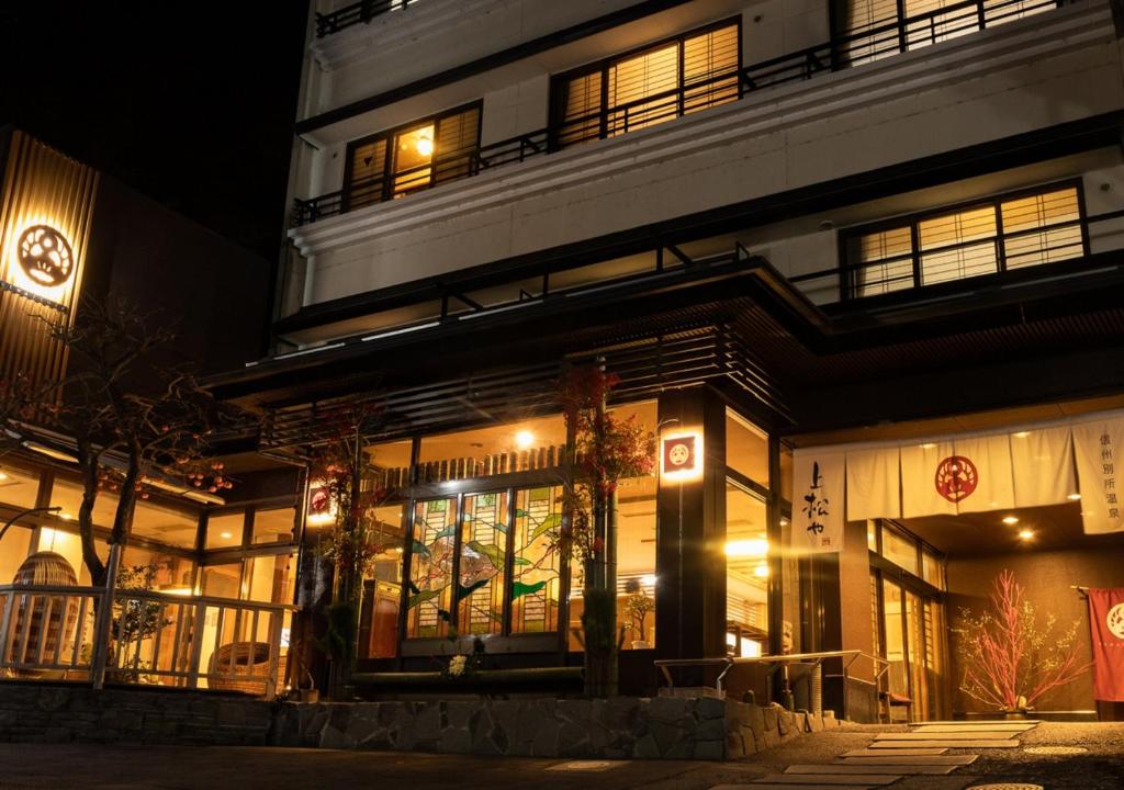 a building at night with lights in front of it at Uematsuya in Ueda