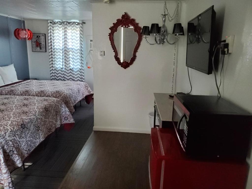 Postel nebo postele na pokoji v ubytování Sage Motel
