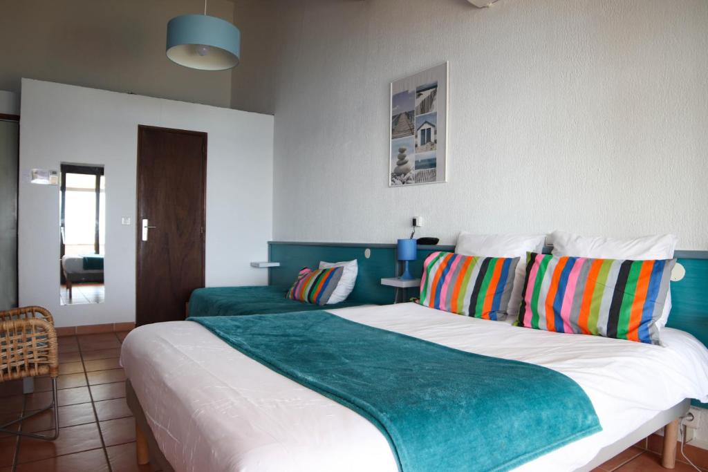 Postel nebo postele na pokoji v ubytování Hotel Chanteplage