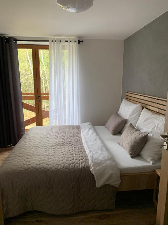 Postel nebo postele na pokoji v ubytování Apartmány Anička