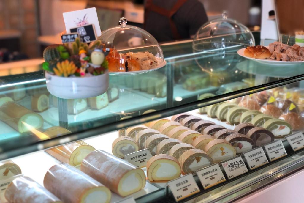 a display case filled with different types of food at Talmud Hotel Taichung in Taichung