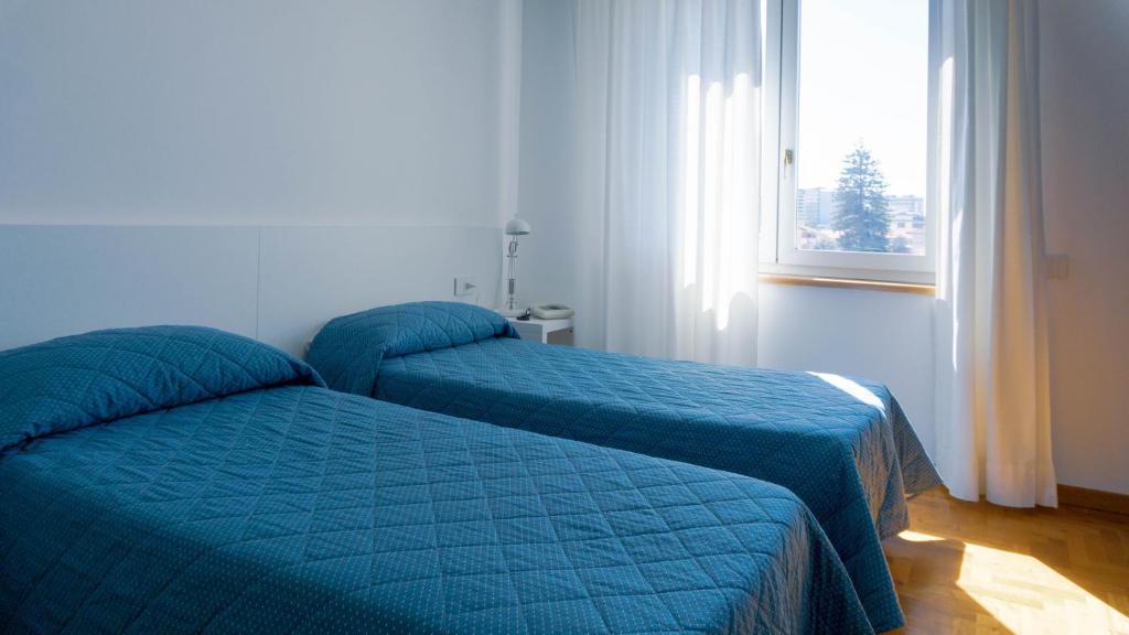Posteľ alebo postele v izbe v ubytovaní Hotel Mistral