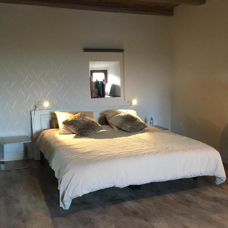 Postel nebo postele na pokoji v ubytování Gîte de La Sagne