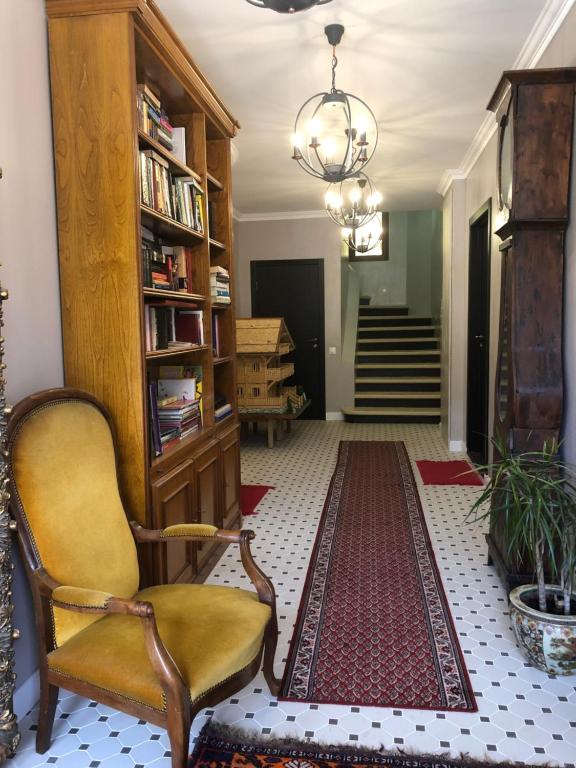 a living room with a chair and a rug at Nant d Ant in Samoëns