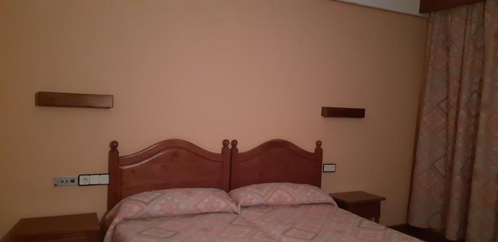 Postel nebo postele na pokoji v ubytování San Glorio