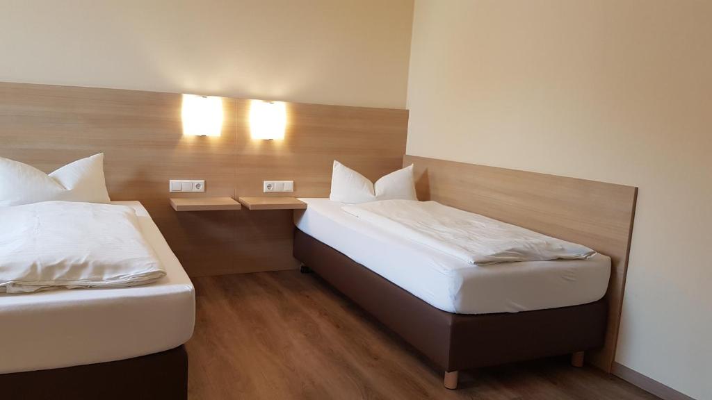 Postel nebo postele na pokoji v ubytování Hotel-Restaurant Stern