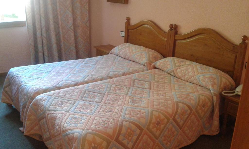 Postel nebo postele na pokoji v ubytování San Glorio