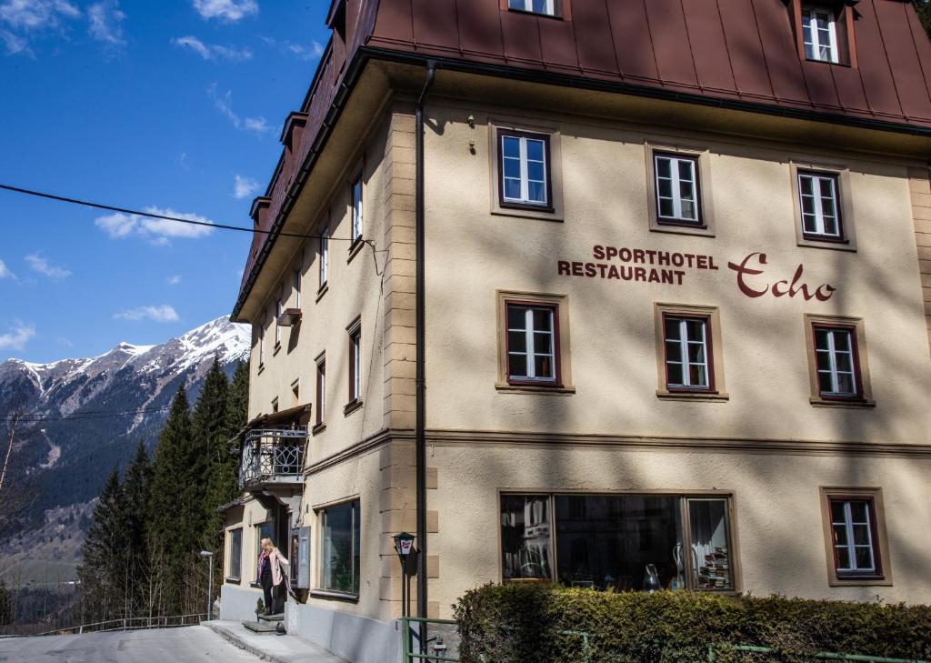 a building with a sign on the side of it at Hotel Echo in Bad Gastein