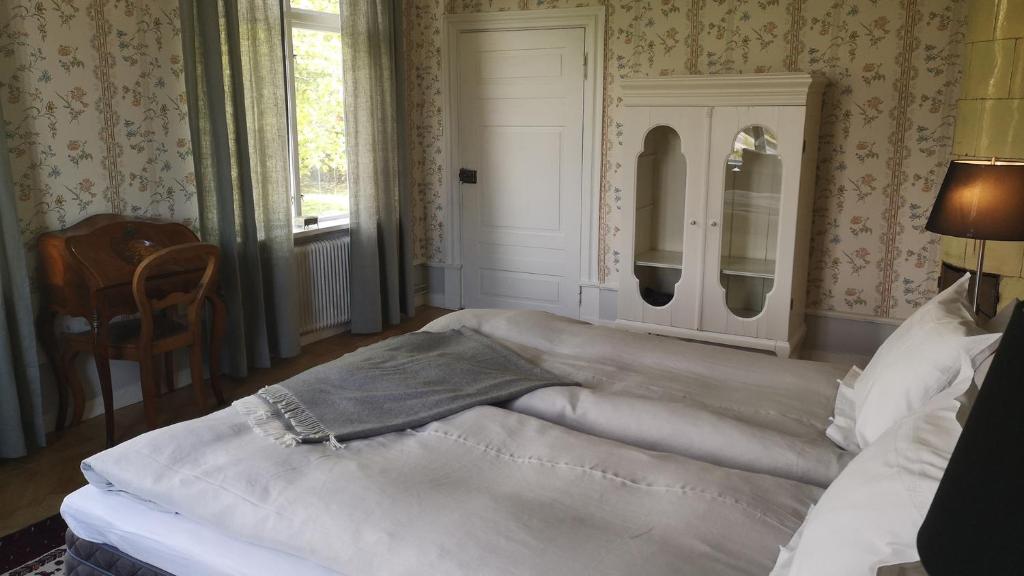 Postel nebo postele na pokoji v ubytování Hoby Gård B&B