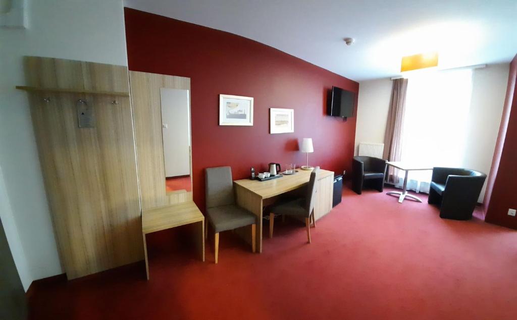 TV a/nebo společenská místnost v ubytování Hotel Arsenał