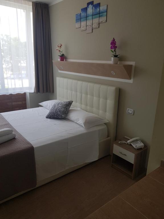 Postel nebo postele na pokoji v ubytování Atico Hotel