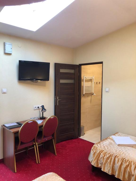 Posteľ alebo postele v izbe v ubytovaní Hotel Sekwana