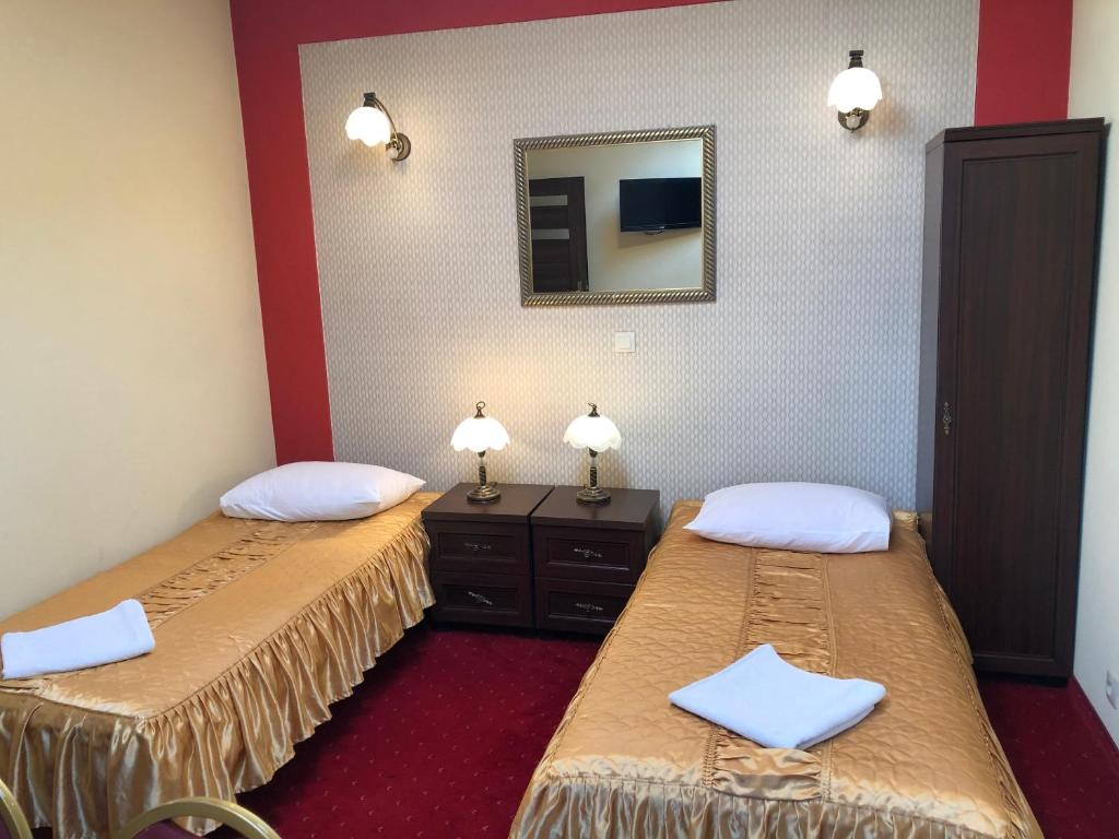 Posteľ alebo postele v izbe v ubytovaní Hotel Sekwana