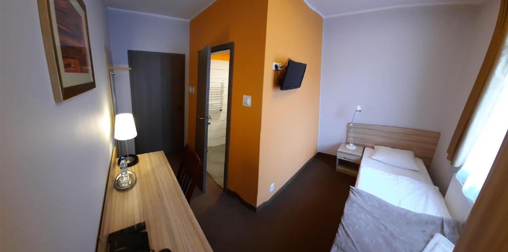 Postel nebo postele na pokoji v ubytování Hotel Arsenał