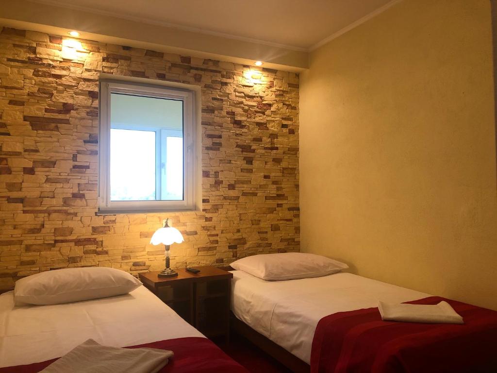 Posteľ alebo postele v izbe v ubytovaní Hotel Sekwana