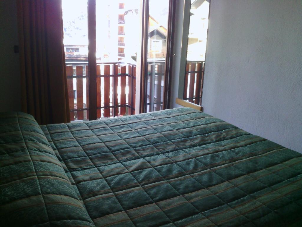 Postel nebo postele na pokoji v ubytování Hotel Savoia Debili