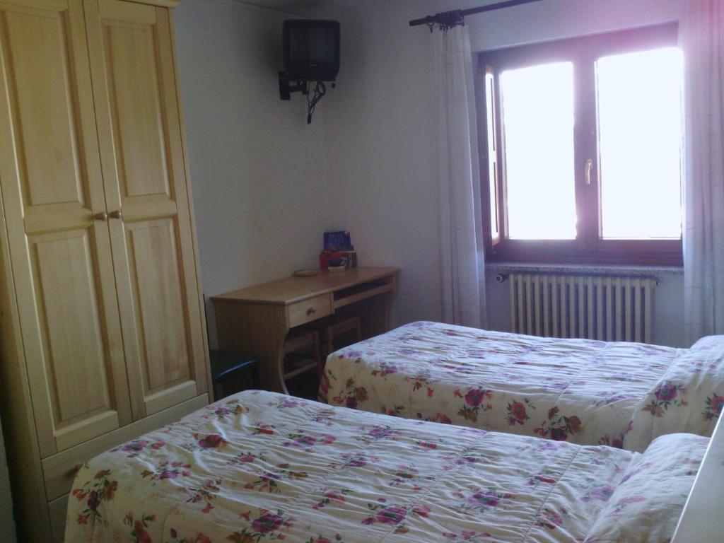 Postel nebo postele na pokoji v ubytování Hotel Savoia Debili