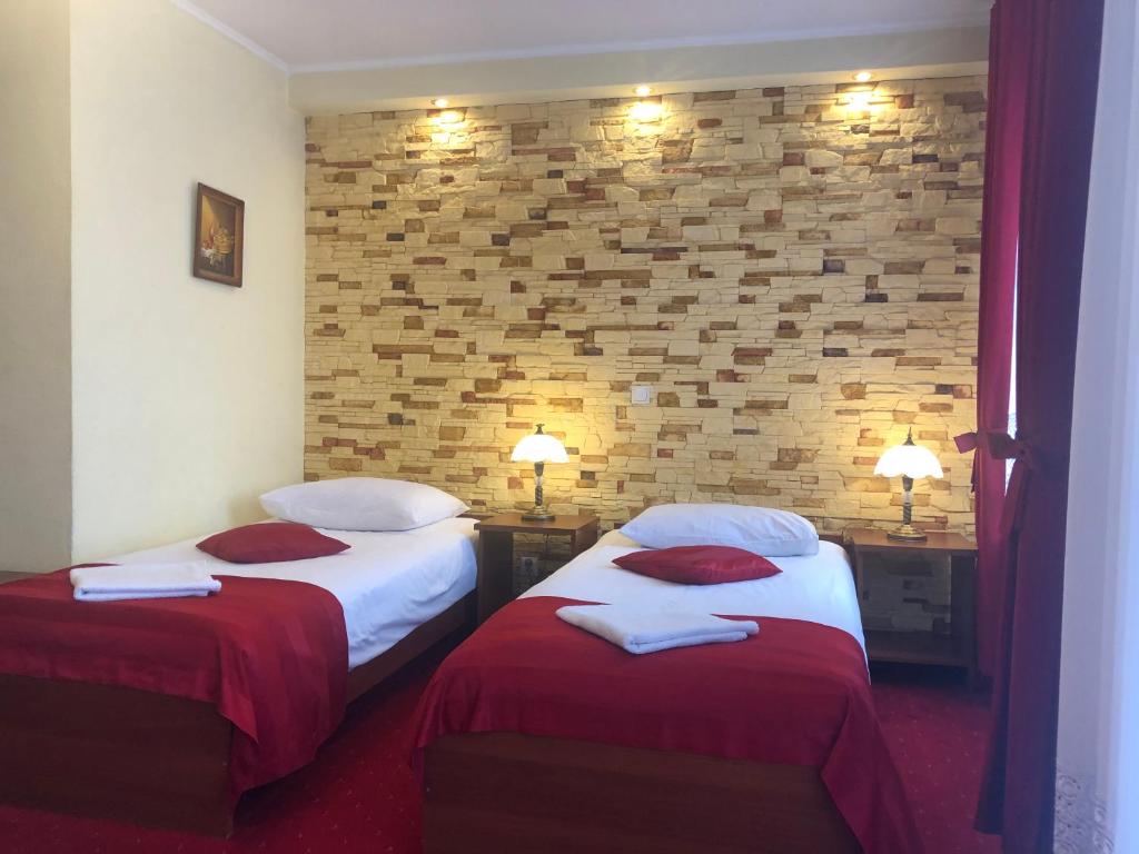 Posteľ alebo postele v izbe v ubytovaní Hotel Sekwana