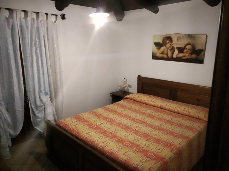 Posteľ alebo postele v izbe v ubytovaní casa vacanze deluxe