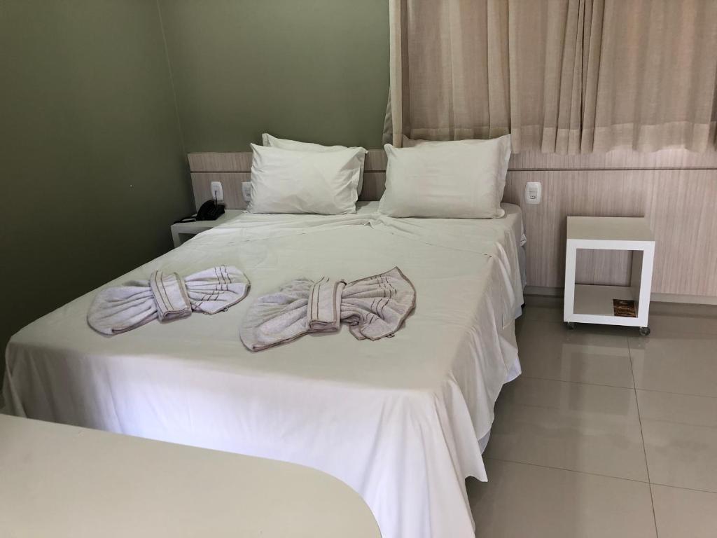 Postel nebo postele na pokoji v ubytování Hotel Roni