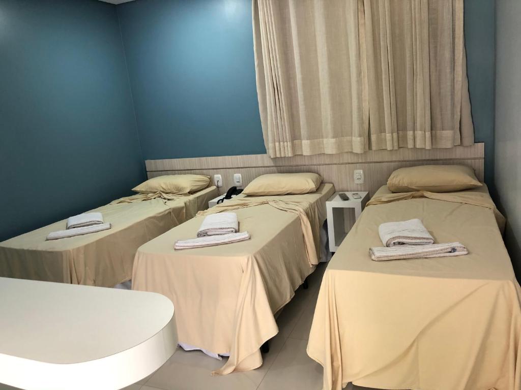 Postel nebo postele na pokoji v ubytování Hotel Roni