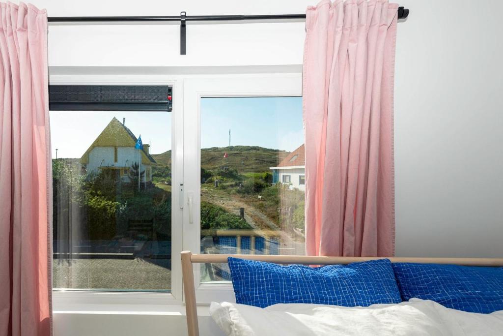 Postel nebo postele na pokoji v ubytování B&B Duinblick