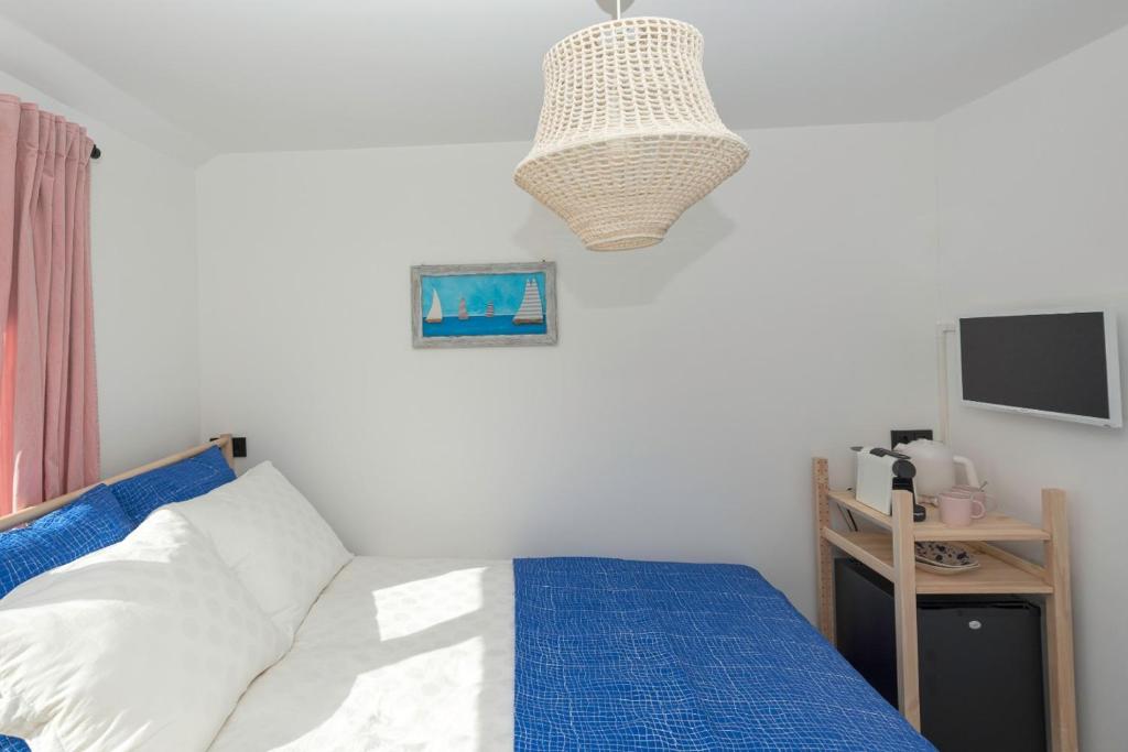 Postel nebo postele na pokoji v ubytování B&B Duinblick