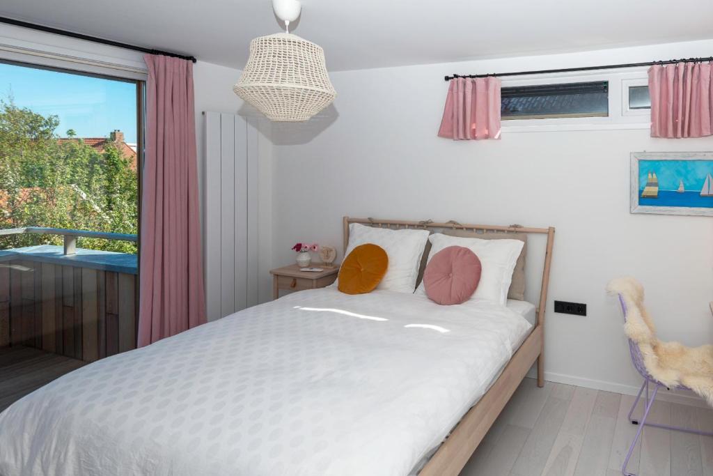 Postel nebo postele na pokoji v ubytování B&B Duinblick