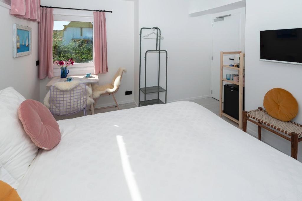 Postel nebo postele na pokoji v ubytování B&B Duinblick