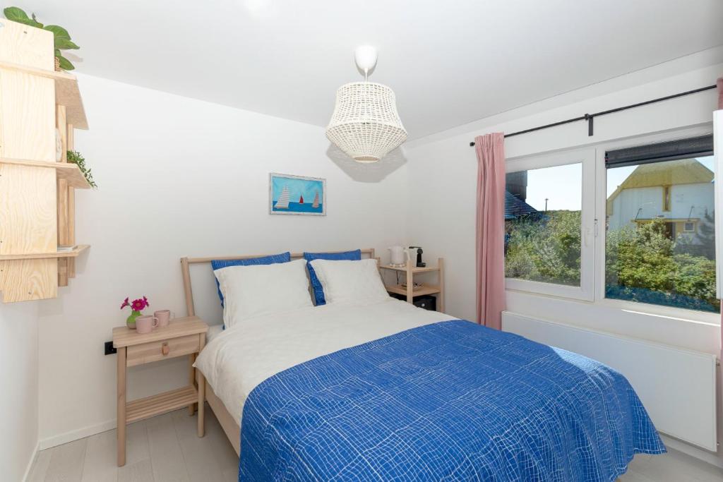 Postel nebo postele na pokoji v ubytování B&B Duinblick