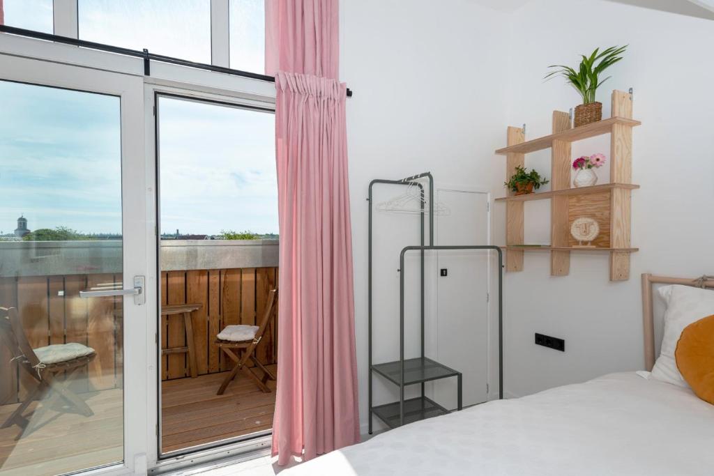 Postel nebo postele na pokoji v ubytování B&B Duinblick