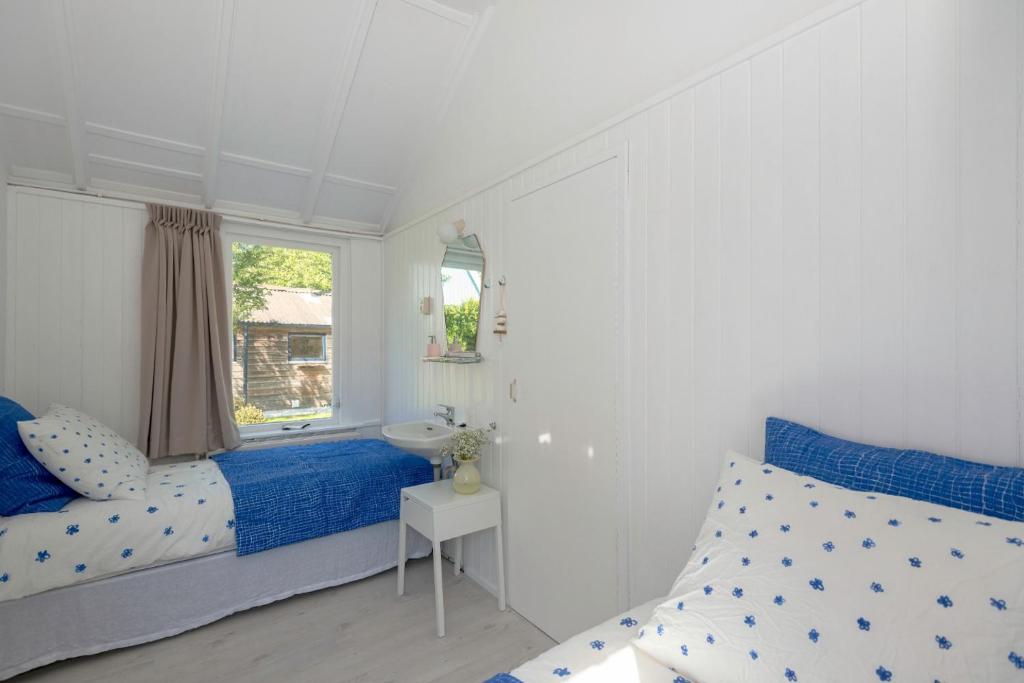 Postel nebo postele na pokoji v ubytování B&B Duinblick