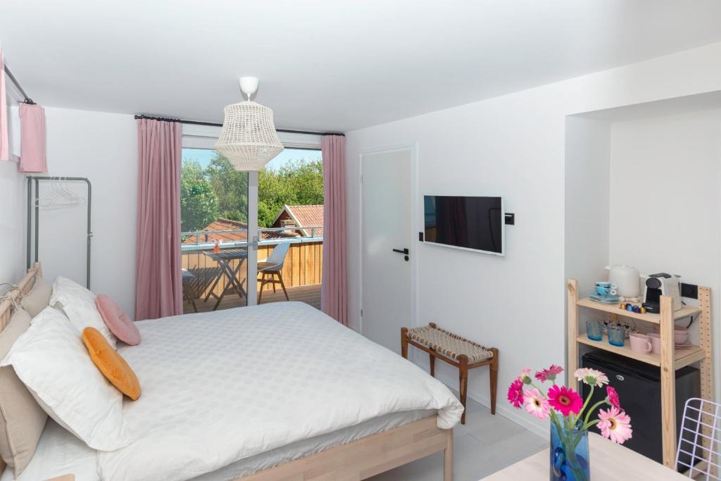 Postel nebo postele na pokoji v ubytování B&B Duinblick