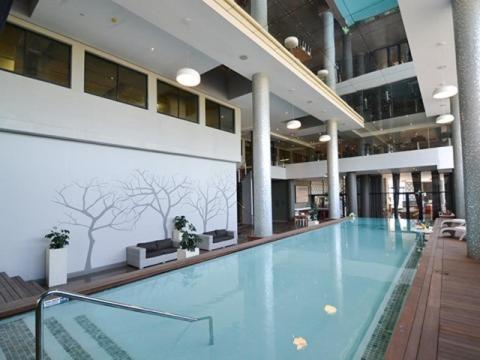 a large swimming pool in a large building at Lily's Haven in Durban