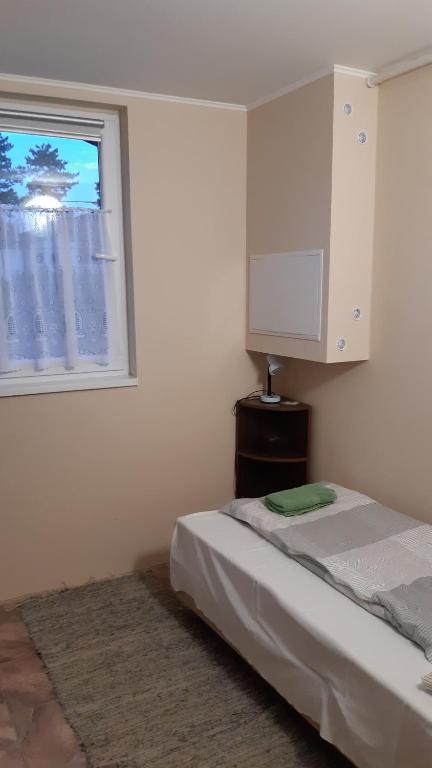 Postel nebo postele na pokoji v ubytování Avar Vendégház