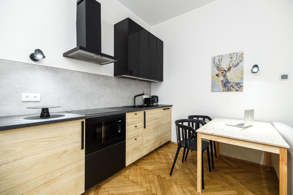 Kuchyňa alebo kuchynka v ubytovaní Native Apartments Żuławskiego 8